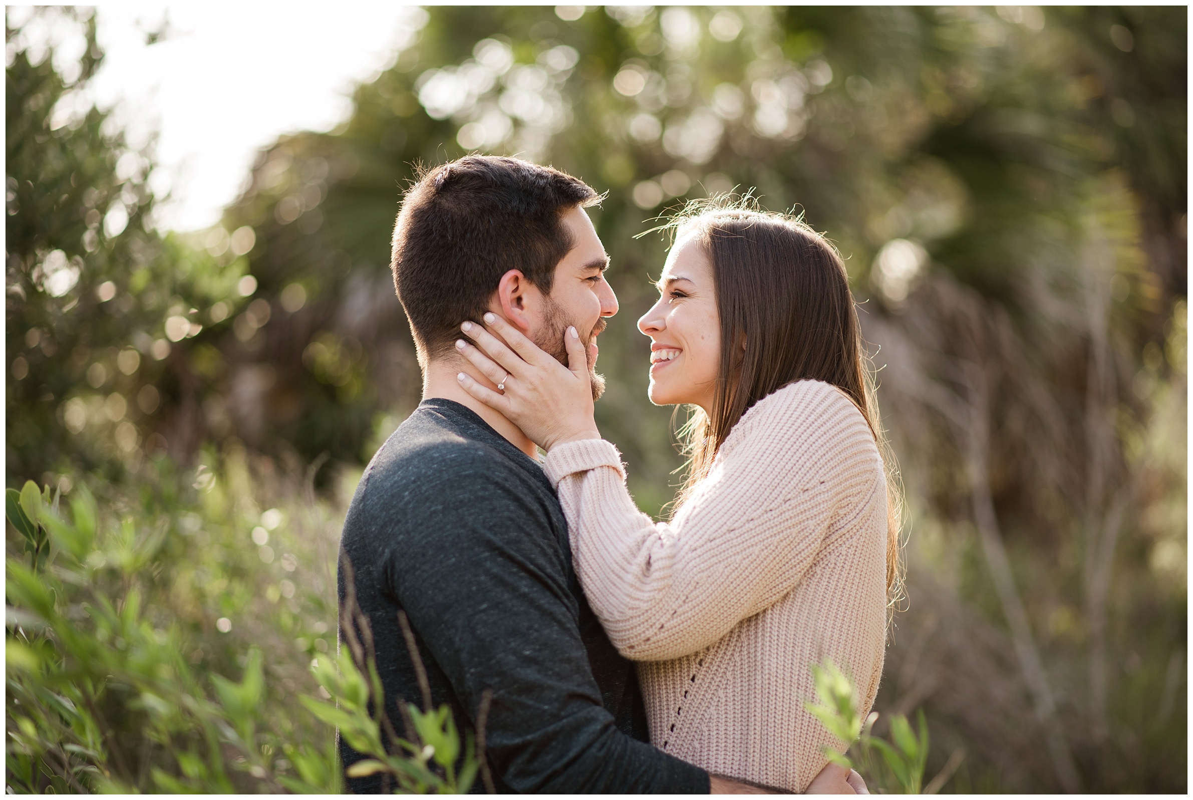 couple smiling at each other in cedar key fl engagement session
